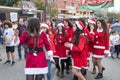 Support group members dressed as Santa Claus entertain participants and visitors of the annual race `Cristmas Run` in Mi`ilya in I Royalty Free Stock Photo