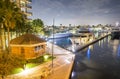 Miami Beach buildings and boats. Night reflections on the river, view from city bridge Royalty Free Stock Photo