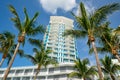 Stock photo Miami Beach condominium building on blue sky with palm trees