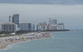 Miami Beach is crowded with people sunbathing. Royalty Free Stock Photo