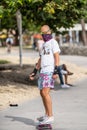 Street photography man riding on a skateboard in Miami Beach