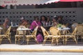 People dining on Ocean Drive Miami Beach FL summertime vacation