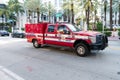 Miami Beach, Florida USA - April 15, 2021: red ford fire rescue truck in miami beach side view. 911