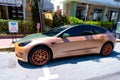 Miami Beach, Florida USA - April 14, 2021: tesla model y orange matte 2019, side view.