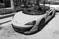 Miami Beach, Florida USA - April 15, 2021: white mclaren 570s convertible sportcar, corner view