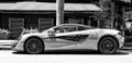 Miami Beach, Florida USA - April 15, 2021: white mclaren 570s parked sportcar, side view