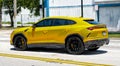 Miami Beach, Florida USA - April 15, 2021: 2019 Yellow Giallo Auge Lamborghini Urus, side view Royalty Free Stock Photo