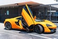 Miami Beach, Florida USA - April 14, 2021: yellow McLaren P1 2012, side view. luxury hypercar