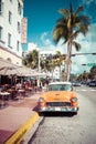 MIAMI BEACH, FLORIDA, USA - FEBRUARY 18, 2018: Vintage Car Parked along Ocean Drive in the Famous Art Deco District in South