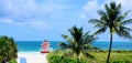 Miami Beach with lifeguard tower and coastline with colorful cloud and blue sky. Atlantic Ocean background. Royalty Free Stock Photo