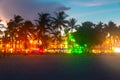 Miami Beach Ocean Drive hotels and restaurants at sunset. City skyline with palm trees at night. Art deco nightlife on Royalty Free Stock Photo