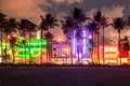 Miami Beach Ocean Drive hotels and restaurants at sunset. City skyline with palm trees at night. Art deco nightlife on Royalty Free Stock Photo