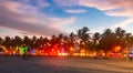 Miami Beach Ocean Drive hotels and restaurants at sunset. City skyline with palm trees at night. Art deco nightlife on Royalty Free Stock Photo