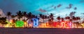 Miami Beach Ocean Drive panorama with hotels and restaurants at sunset. City skyline with palm trees at night. Art deco Royalty Free Stock Photo