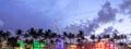Miami Beach Ocean Drive panorama with hotels and restaurants at sunset. City skyline with palm trees at night. Art deco Royalty Free Stock Photo