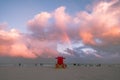 Miami Beach under the bright cloudy sky with a rainbow in the center