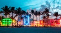 Miami Beach, USA - September 10, 2019: Ocean Drive hotels and restaurants at sunset. City skyline with palm trees at Royalty Free Stock Photo