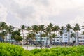 Miami Beach, USA - September 10, 2019: Ocean Drive in Miami Beach at sunset. City skyline with palm trees at dusk. Art Royalty Free Stock Photo