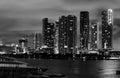 Miami city night. Miami Florida at sunset, skyline of illuminated buildings and Macarthur Causeway bridge. Royalty Free Stock Photo