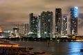 Miami city night. Miami Florida at sunset, skyline of illuminated buildings and Macarthur Causeway bridge. Royalty Free Stock Photo