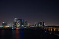 Miami city skyline panorama at dusk with urban skyscrapers and bridge over sea with reflection Royalty Free Stock Photo
