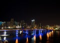 Miami city skyline panorama at dusk with urban skyscrapers and bridge over sea with reflection Royalty Free Stock Photo