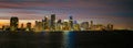 Miami city skyline panorama with urban skyscrapers over sea with reflection. Miami downtown view at night. Downtown Royalty Free Stock Photo