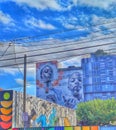 Miami Design District, Murals, graffiti, art showing people, colorful background, blue sky with clouds, city architecture