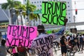 Miami Downtown, FL, USA - MAY 31, 2020: Black man with posters against US President Donald Trump. Trump is the virus it