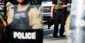 Miami Downtown, FL, USA - MAY 31, 2020: Police officers with weapons in the streets of Miami. Protection and security.