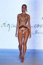 A model walks runway at the  Aqua de Coco show at Planet Fashion TV show Royalty Free Stock Photo