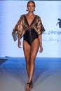 A model walks runway at the  Aqua de Coco show at Planet Fashion TV show Royalty Free Stock Photo