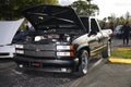 Chevy pick up truck lit with studio strobes in a parking lot