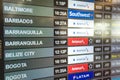 Miami, Florida - Departure board at Miami International Airport displaying flights to various destinations with Royalty Free Stock Photo