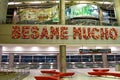 Sign flower Besame Mucho and minimalist armchairs at Miami International Airport . Royalty Free Stock Photo