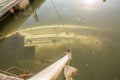 Miami, Florida - September 16, 2017: Sunken boat on Brickell Bay avenue marina days after hurricane Irma strikes the city during