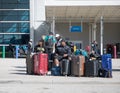 Two men with a lot of suitcases waiting for the bus Royalty Free Stock Photo