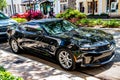 Miami, Florida USA - March 25, 2023: black 2016 Chevrolet Camaro 1LT Chevy car vehicle, side view