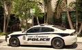 Miami, Florida USA - March 25, 2023: Dodge Charger police emergency car in miami fort lauderdale, side view.