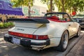 Miami, Florida USA - March 25, 2023: white Porsche930 retro vintage classic convertible car, back view