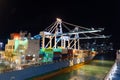 Miami, Florida USA - November 23, 2015: cargo barge ship with containers in port at night Royalty Free Stock Photo