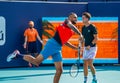 Australian tennis players Nick Kyrgios L and Thanasi Kokkinakis warm up before 2022 Miami Open men`s doubles semifinal Royalty Free Stock Photo