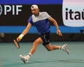 Grigor Dimitrov of Bulgaria in action during quarter-final match against Carlos Alcaraz of Spain at 2024 Miami Open