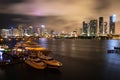 Miami skyline. Beautiful colorful city of Miami Florida skyline and bay with night clouds. Royalty Free Stock Photo