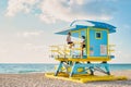 Miami south beach Florida, couple by lifeguard hut during Sunrise Miami Beach, men and woman on the beach Royalty Free Stock Photo