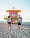 Miami south beach Florida, couple by lifeguard hut during Sunrise Miami Beach Royalty Free Stock Photo