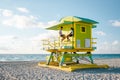 Miami south beach Florida, couple by lifeguard hut during Sunrise Miami Beach, men and woman on the beach Royalty Free Stock Photo