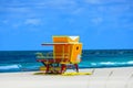 Miami South Beach lifeguard tower and coastline with cloud and blue sky. Sandy Tropical Scene. Royalty Free Stock Photo