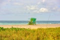 Miami South Beach skyline. Lifeguard tower in colorful Art Deco style and Atlantic Ocean at sunshine. Miami Beach Royalty Free Stock Photo