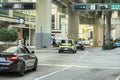 Miami street traffic with driving cars at urban intersection with traffic lights in Florida Royalty Free Stock Photo